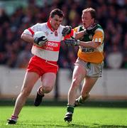 26 April 1998; Joe Brolly of Derry in action against David Foley of Offaly during the Church & General National Football League Final match between Offaly and Derry at Croke Park in Dublin. Photo by Ray McManus/Sportsfile