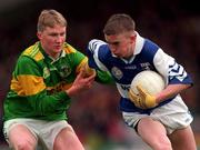 9 May 1998. Laois' Joe Higgins holds off the challenge of Kerry's Michael F Russell in the Final. All-Ireland U-21 Football Final, Kerry v Laois, Gaelic Grounds, Limerick. Picture Credit: Ray McManus SPORTSFILE.