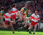 26 April 1998; John Ryan of Offaly in action against Gary Magill of Derry during the Church & General National Football League Final match between Offaly and Derry at Croke Park in Dublin. Photo by Ray McManus/Sportsfile