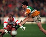 26 April 1998; Vinny Claffey of Offaly in action against Johnny McBride of Derry during the Church & General National Football League Final match between Offaly and Derry at Croke Park in Dublin. Photo by Matt Browne/Sportsfile