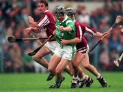 5 October 1997; Mike Galligan of Limerick in action against Michael Donoghue and Liam Burke, left, of Galway during the National Hurling League Final match between Limerick and Galway at Cusack Park in Ennis, Clare. Photo by Ray McManus/Sportsfile