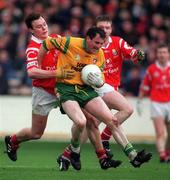 5 April 1998; Noel Hegarty of Donegal in action against Michael Monaghan of Cork during the National Football League Quarter-Final match between Cork and Donegal at Croke Park in Dublin. Photo by Ray McManus/Sportsfile