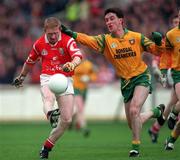 5 April 1998; Aidan Dorgan of Cork in action against Barry McGowan of Donegal during the National Football League Quarter-Final match between Cork and Donegal at Croke Park in Dublin. Photo by Ray McManus/Sportsfile