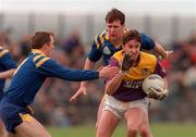 10 May 1998; Ollie Kinlough of Wexford in action against Gary Brady, left, and Enda Barden of Longford during the Leinster Senior Football Championship Preliminary Round Replay match between Longford and Wexford at Pearse Park in Longford. Photo by Matt Browne/Sportsfile