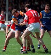 31 May 1998 Ronan Coffey (Wicklow) is tackled by  Stephen Meila (Louth) during the Louth v Wicklow Bank of Ireland Football Championship Drogheda Co.Louth Picture Credit Matt Browne SPORTSFILE