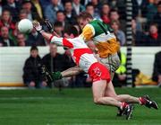 26 April 1998; Ronan Mooney of Offaly in action against Fergal McCusker of Derry during the Church & General National Football League Final match between Offaly and Derry at Croke Park in Dublin. Photo by Matt Browne/Sportsfile