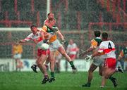 26 April 1998; Fergal McCusker and Dermot Dougan of Derry in action against Ronan Mooney of Offaly during the Church & General National Football League Final match between Offaly and Derry at Croke park in Dublin. Photo by Ray McManus/Sportsfile