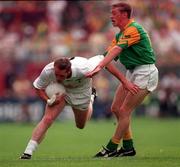 3 August 1997. Kildare's Willie McCreery holds off Meath's Trevor Giles. Meath v Kildare. Leinster Football Championship Semi Final 1st replay, Croke Park, Dublin. Picture Credit: Ray McManus/SPORTSFILE