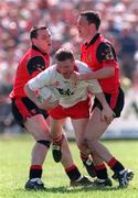 17 May 1998; Stephen Lawn of Tyrone in action against Michael Magill, left, and Simon Pollard of Down during the Ulster GAA Football Senior Championship Preliminary Round match between Tyrone and Down at St. Tiernach's Park in Clones, Co Monaghan. Photo by David Maher/SPORTSFILE