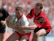 17 May 1998; Stephen Lawn of Tyrone in action against Brian Burns of Down during the Ulster GAA Football Senior Championship Preliminary Round match between Tyrone and Down at St Tiernach's Park in Clones, Monaghan. Photo by David Maher/Sportsfile