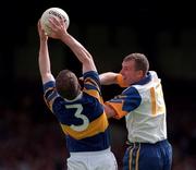 28 June 1998. Tipperary's Conor O'Dwyer makes a clean catch under pressure from Clare's Martin Daly. Tipperary v Clare, Munster Football Championship, Gaelic Grounds. Picture Credit: Brendan Moran/SPORTSFILE.