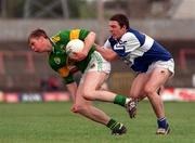 9 May 1998. Kerry's Tomás O'SŽ gets away from Laois' Ian Fitzgerald. U-21 Football Final, Gaelic Grounds. Picture Credit: Brendan Moran/SPORTSFILE.