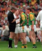 2 August 1998; Tommy Dowd of Meath is booked by referee John Bannon during the Leinster Senior Football Championship Final match between Kildare and Meath at Croke Park in Dublin. Picture credit: Ray McManus/Sportsfile