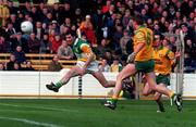 12 April 1998; Vinny Claffey of Offaly shoots the ball forward during the Church & General National Football League Semi-Final match between Donegal and Offaly at Croke Park in Dublin. Photo by Ray Lohan/Sportsfile