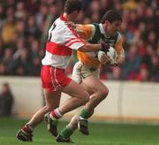 26 April 1998; Vinny Claffey of Offaly in action against Sean Longhart of Derry during the Church & General National Football League Final match between Offaly and Derry at Croke Park in Dublin. Photo by Ray McManus/Sportsfile