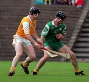 21 June 1998. London's Willie Lohan holds off the challenge of Antrim's Gregory O'Kane. Antrim v London, Ulster Hurling Championship, Casement Park, Belfast. Picture Credit: Damien Eagers/SPORTSFILE.