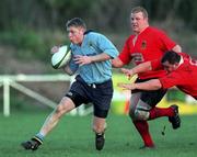 6 January 2001; Niall Breslin of UCD escapes the tackle of Garvan Lynch and David lane, right, of Midleton during the AIB All-Ireland League Divison 2 match between UCD and Midleton at Belfield in Dublin. Photo by Aoife Rice/Sportsfile