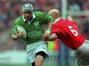 1 April 2000; Andy Ward of Ireland is tackled by Nathan Budgett of Wales during the Lloyds TSB 6 Nations match between Ireland and Wales at Lansdowne Road in Dublin. Photo by Brendan Moran/Sportsfile