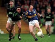 3 December 2000; David O'Donoghue of Glenflesk clears the ball ahead of Martin Cronin of Nemo Rangers during the AIB Munster Club Football Championship Final match between Nemo Rangers and Glenflesk at the Gaelic Grounds in Limerick. Photo by Brendan Moran/Sportsfile
