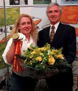 25 August 1997; Minister for Sport Dr Jim McDaid T.D pictured with Irish swimmer Michelle de Bruin and her medals on her return from the European Swimming Championships in Seville at Dublin Airport in Dublin. Photo by Matt Browne/Sportsfile