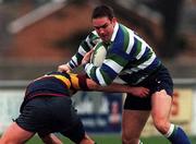 27 November 1999; Finbar Hayes of Suttonians RFC is tackled by Simon Cooney of Banbridge RFC during the AIB All-Ireland League Division 4 match between Suttonians RFC and Banbridge RFC at the McDowell Grounds in Sutton, Dublin. Photo by Matt Browne/Sportsfile