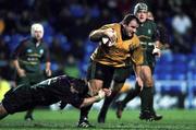 5 December 2000; George Graham of Newcastle Falcons is tackled by Eddie Halvey of London Irish during the Zurich Premiership match between London Irish and Newcastle Falcons at the Madejski Stadium in Reading, England. Photo by Brendan Moran/Sportsfile