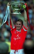 24 September 2000; James Masters of Cork lifts the cup following the All Ireland Minor Football Championship Final match between Cork and Mayo at Croke Park in Dublin. Photo by Ray Lohan/Sportsfile