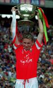 24 September 2000; James Masters of Cork lifts the cup following the All Ireland Minor Football Championship Final match between Cork and Mayo at Croke Park in Dublin. Photo by Ray McManus/Sportsfile