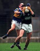3 December 2000; Joe Kavanagh of Nemo Rangers is put under pressure by Paul Favier of Glenflesk during the AIB Munster Club Football Championship Final match between Nemo Rangers and Glenflesk at the Gaelic Grounds in Limerick. Photo by Brendan Moran/Sportsfile