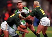 19 November 2000; Kieron Dawson of Ireland, supported by Rob Henderson, is tackled by Andre Vos, left, and Percy Montgomery of South Africa during the International Rugby Friendly match between Ireland and South Africa at Lansdowne Road in Dublin. Photo by  Ray Lohan/Sportsfile