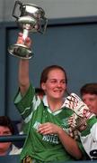 25 September 1998; The London Ladies Captain lifts the Cup following the Irish Holidays International Football Festival match between London and North American Board  at Parnell Park, Dublin. Photo by David Maher/Sportsfile