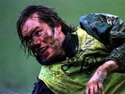 February 1996; Rep of Ireland's Jason McAteer gets covered in muck during a training session in Ivor Park, Pontyclun, South Wales. Soccer. Picture credit; David Maher/SPORTSFILE