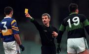 3 December 2000; Referee Paddy Russell shows a yellow card to Michael O'Donoghue of Glenflesk and Colin Corkery of Nemo Rangers during the AIB Munster Club Football Championship Final match between Nemo Rangers and Glenflesk at the Gaelic Grounds in Limerick. Photo by Brendan Moran/Sportsfile