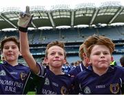 21 October 2015; St Pius X BNS Terenure players, from left, Adam Clarke, Oisín Horan and Conor Hopkins, celebrate their win in the Corn na NGearaltach over Bishop Galvin. Allianz Cumann na mBunscol Finals. Croke Park, Dublin. Picture credit: Piaras Ó Mídheach / SPORTSFILE