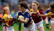 21 October 2015; Alicia George, Holy Child National School, in action Sacred Heart NS Sruleen's, from left, Tori Barton, Ciara Barry and Gemma Maguire. Sacred Heart NS Sruleen v Holy Child National School, Sciath na Laoch final. Allianz Cumann na mBunscol Finals. Croke Park, Dublin. Picture credit: Piaras Ó Mídheach / SPORTSFILE