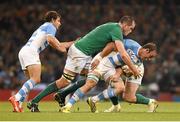 18 October 2015; Leonardo Senatore, Argentina, is tackled by Devin Toner, left, and Cian Healy, Ireland. 2015 Rugby World Cup Quarter-Final, Ireland v Argentina. Millennium Stadium, Cardiff, Wales. Picture credit: Stephen McCarthy / SPORTSFILE
