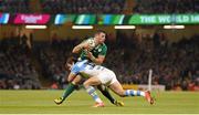 18 October 2015; Robbie Henshaw, Ireland, is tackled by Nicolas Sanchez, Argentina. 2015 Rugby World Cup Quarter-Final, Ireland v Argentina. Millennium Stadium, Cardiff, Wales. Picture credit: Stephen McCarthy / SPORTSFILE