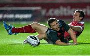 23 October 2015; Andrew Conway, Munster, scores his side's opening try despite the efforts of Hadleigh Parkes, Scarlets. Guinness PRO12, Round 5, Scarlets v Munster. Parc Y Scarlets, Llanelli, Wales. Picture credit: Chris Fairweather / SPORTSFILE