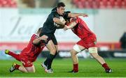 23 October 2015; Ian Keatley, Munster, is tackled by Samson Lee and James Davies, Scarlets. Guinness PRO12, Round 5, Scarlets v Munster. Parc Y Scarlets, Llanelli, Wales. Picture credit: Chris Fairweather / SPORTSFILE