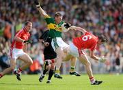 13 June 2009; Tomas O Se, Kerry, loses possession after a shoulder from Graham Canty, 6, Cork. GAA Football Munster Senior Championship Semi-Final Replay, Cork v Kerry, Pairc Ui Chaoimh, Cork. Picture credit: Brendan Moran / SPORTSFILE
