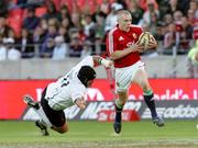 16 June 2009; Keith Earls, British and Irish Lions, evades the tackle of Dean Greyling, Southern Kings VX. Southern Kings VX v British and Irish Lions, Nelson Mandela Bay Stadium, Port Elizabeth, South Africa. Picture credit: Seconds Left / SPORTSFILE