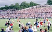 23 July 1995; Tyrone supporters run onto the pitch following Tyrone's 2-13 to 0-7 victory over Cavan. Ulster Senior Football Championship Final, Tyrone v Cavan, St. Tighearnach's Park, Clones, Co. Monaghan. Picture credit: Ray McManus / SPORTSFILE