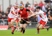 21 June 2009; Eunan McMullan, Down, in action against Benny Herron, left, and Christopher Convery, Derry. Ulster Minor Hurling Championship Semi-Final, Derry v Down, Casement Park, Belfast, Co. Antrim. Photo by Sportsfile