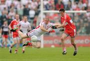 21 June 2009; Kevin Hughes, Tyrone, in action against Chrissy McKaigue, Derry. GAA Football Ulster Senior Championship Semi-Final, Tyrone v Derry, Casement Park, Belfast, Co. Antrim. Photo by Sportsfile