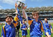 18 June 2009; Our Ladys BNS captains Barry Mannion, left, and Sean Casserly, celebrate with the Corn Harry Conlon after the match. Allianz Cumann na mBunscoil Finals, Our Ladys BNS, Ballinteer, v Scoil Colm, Crumlin, Corn Harry Conlon, Croke Park, Dublin. Picture credit: Brian Lawless / SPORTSFILE
