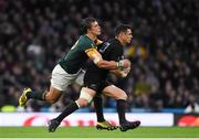 24 October 2015; Dan Carter, New Zealand, is tackled by Handré Pollard, South Africa. 2015 Rugby World Cup, Semi-Final, New Zealand v South Africa. Twickenham Stadium, Twickenham, London, England. Picture credit: Ramsey Cardy / SPORTSFILE