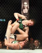 24 October 2015; Aisling Daly, top, in action against Ericka Almeida. UFC Fight Night. 3Arena, Dublin. Picture credit: Stephen McCarthy / SPORTSFILE