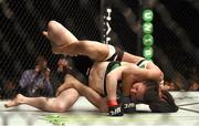24 October 2015; Aisling Daly, bottom, in action against Ericka Almeida. UFC Fight Night. 3Arena, Dublin. Picture credit: Stephen McCarthy / SPORTSFILE
