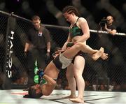 24 October 2015; Aisling Daly, right, in action against Ericka Almeida. UFC Fight Night. 3Arena, Dublin. Picture credit: Stephen McCarthy / SPORTSFILE