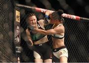 24 October 2015; Aisling Daly, left, in action against Ericka Almeida. UFC Fight Night. 3Arena, Dublin. Picture credit: Stephen McCarthy / SPORTSFILE